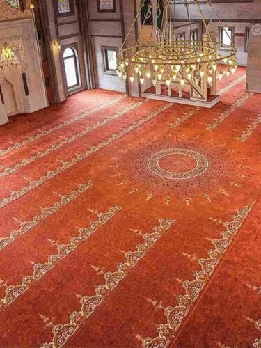 Ornate red carpeted mosque interior