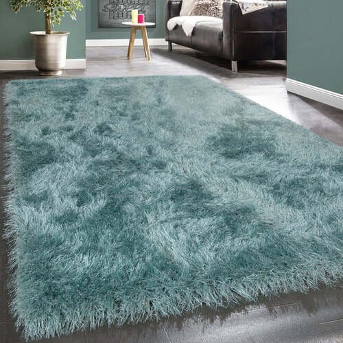 Soft teal shaggy area rug